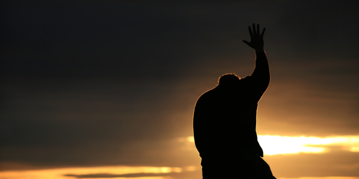Man reaching to God in prayer, lessons in suffering banner
