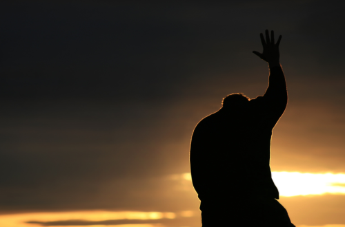 Man reaching to God in prayer, lessons in suffering banner