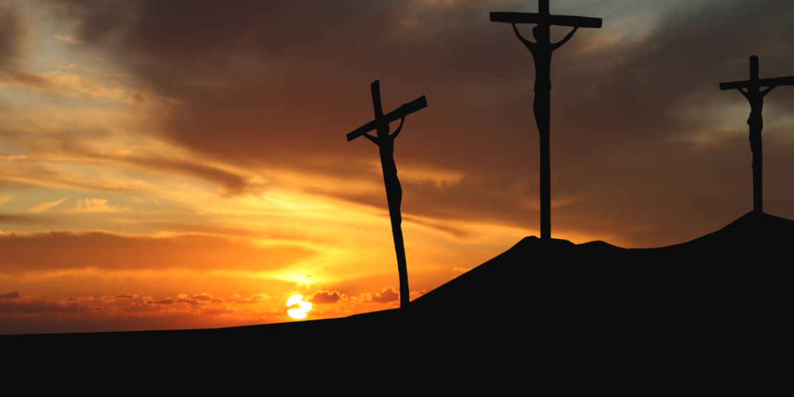 Sometimes the cross is real banner... Three crosses on a hill at sunset