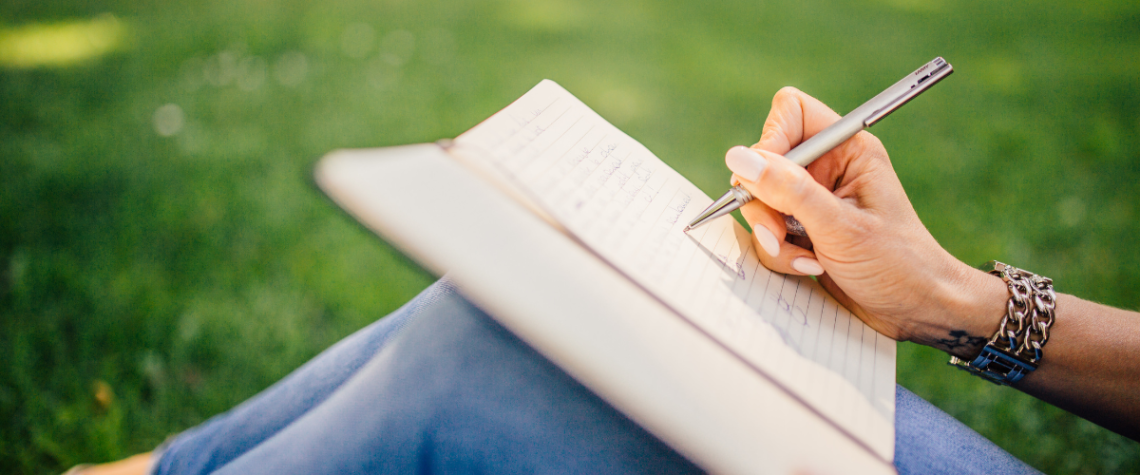 meditations with an ink pen banner: person writing verses in a notebooks